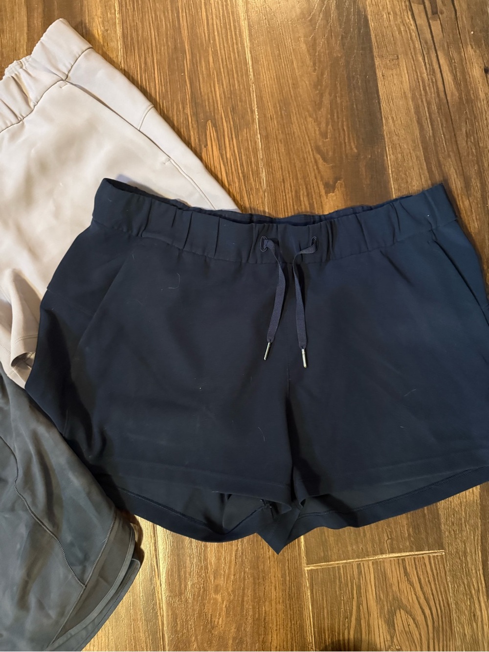 3 pair of lululemon shorts. 2 are size 12 and the gray are size 10. - Picture 2 of 7